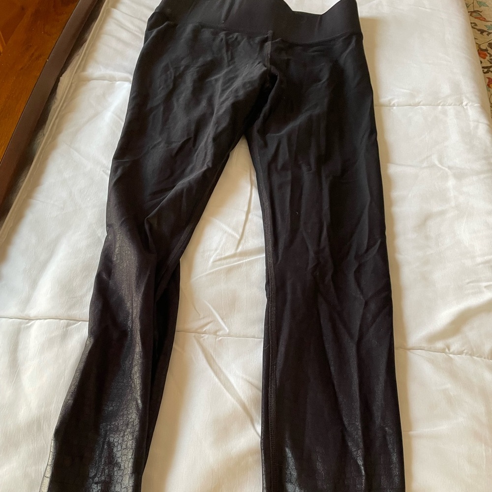 Carbon38 brand shiny snake print leggings.
